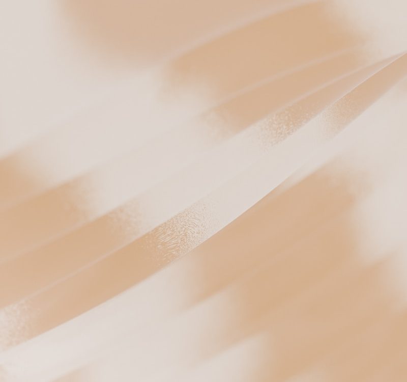 A blurry photo of a person holding a cell phone